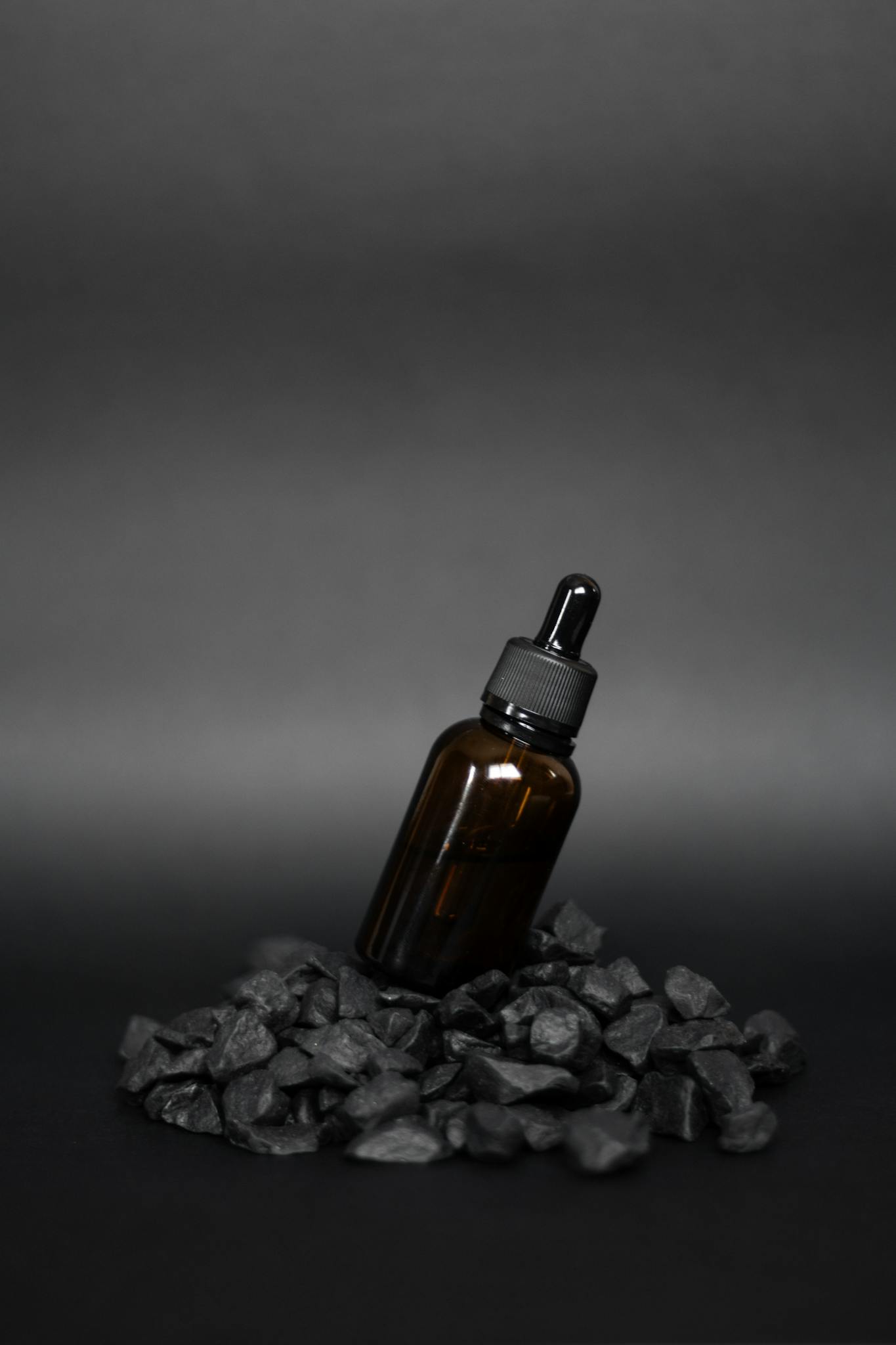 About Brown Dropper Bottle On A Pile Of